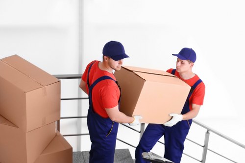 People preparing boxes for Archway removals in a home move
