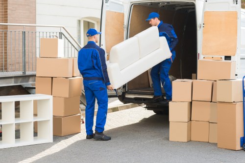 Removal team loading furniture for an Archway house move